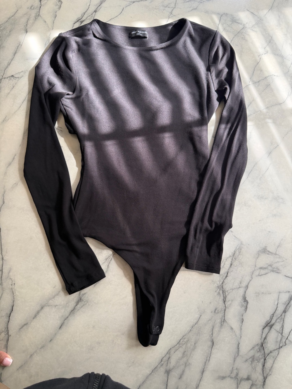 Naked Wardrobe Women’s Black Long-Sleeve Bodysuit with cutout in back, SZ M